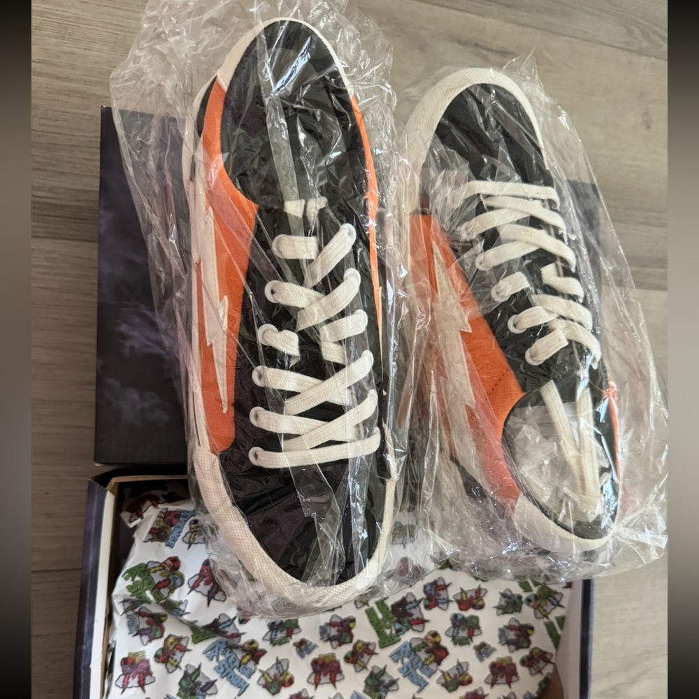 Revenge x storm men’s orange black low top. Size 8.
